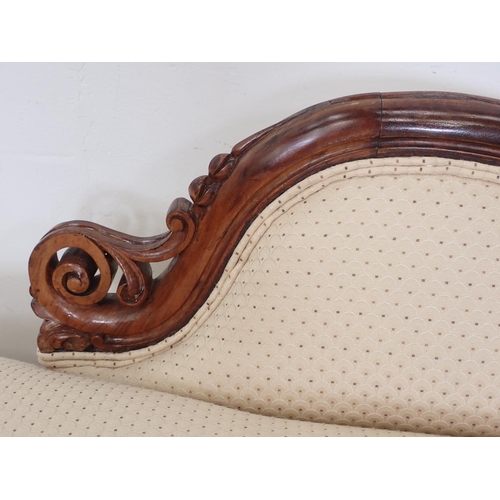 1034 - A Victorian walnut framed Chaise Longue on cabriole legs and casters with acorn finials, 4ft 6in