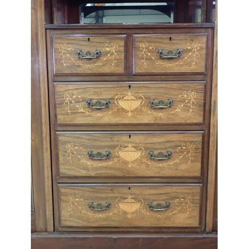 1036 - A 19th Century mahogany and rosewood Compactum Wardrobe having inverted breakfront above pair of mir... 