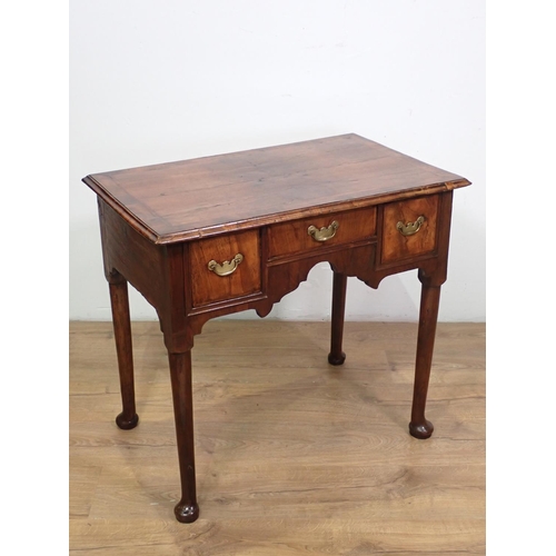 1041 - An 18th Century walnut Side Table fitted three drawers with herringbone banding above shaped frieze ... 