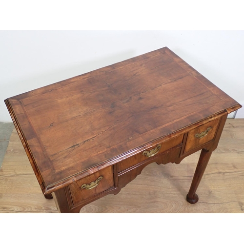 1041 - An 18th Century walnut Side Table fitted three drawers with herringbone banding above shaped frieze ... 