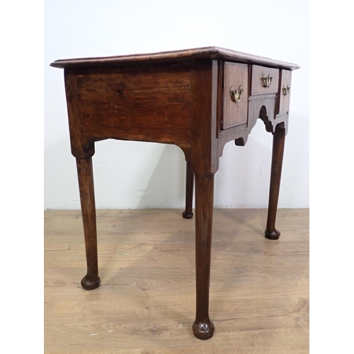 1041 - An 18th Century walnut Side Table fitted three drawers with herringbone banding above shaped frieze ... 