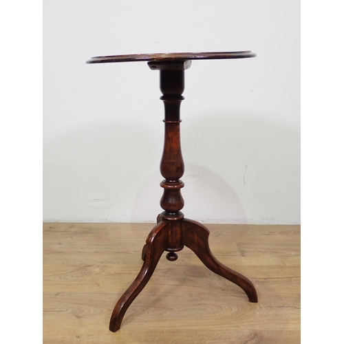 1043 - A Victorian walnut circular Games Table with inlaid chessboard top on baluster turned column and tri... 