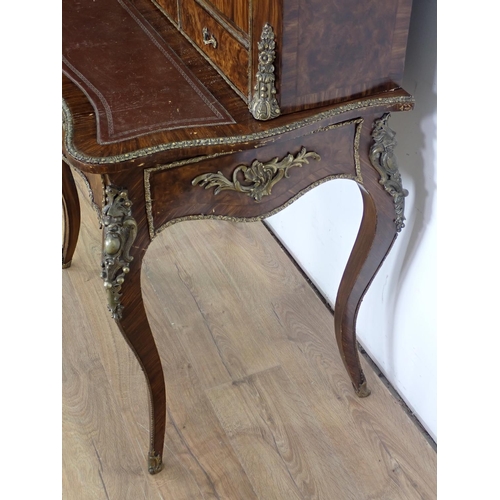 1047 - A 19th Century Louis XV style Bonheur du Jour with simulated walnut and kingwood staining, fitted pa... 