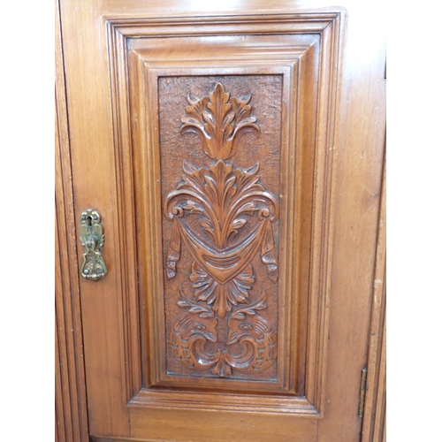 1049 - A late Victorian walnut Sideboard with raised mirror back having leafage scroll carved surmount, lea... 