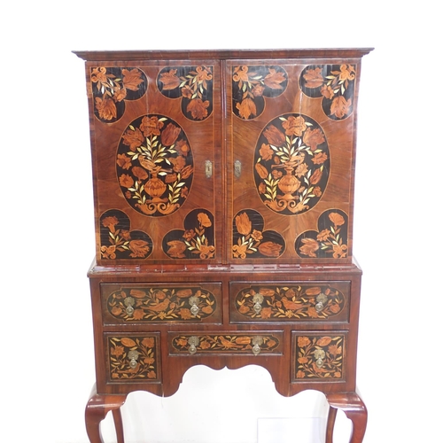 1051 - An antique walnut and floral marquetry Cabinet on Stand in the late 17th Century style, the upper se... 