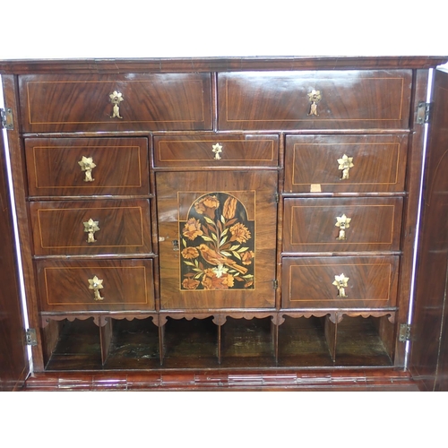 1051 - An antique walnut and floral marquetry Cabinet on Stand in the late 17th Century style, the upper se... 