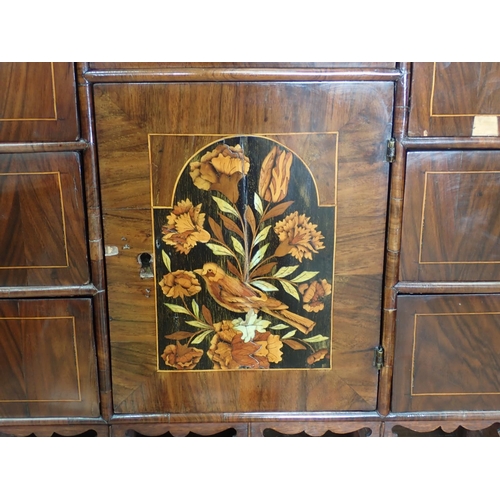 1051 - An antique walnut and floral marquetry Cabinet on Stand in the late 17th Century style, the upper se... 