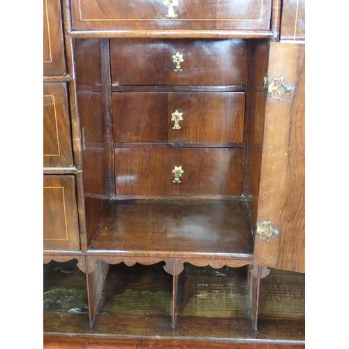 1051 - An antique walnut and floral marquetry Cabinet on Stand in the late 17th Century style, the upper se... 