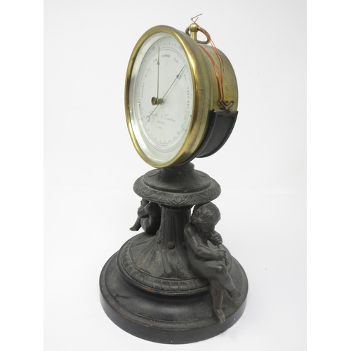 1062 - A brass cased Aneroid Barometer by Negretti and Zambra, London No 2281, on spelter stand with pair o... 