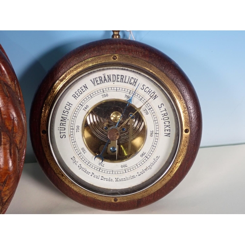 1063 - An oak rope twist cased circular aneroid Barometer, 9in, and two other small aneroid Barometers, one... 