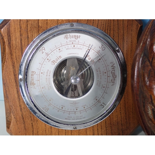 1063 - An oak rope twist cased circular aneroid Barometer, 9in, and two other small aneroid Barometers, one... 