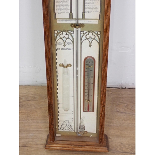 1068 - A 20th Century oak cased Admiral Fitzroy Barometer with broken arch pediment and turned finial, 3ft ... 