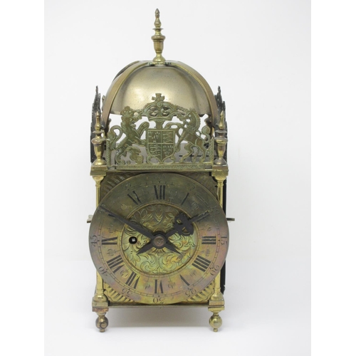 1075 - A brass cased antique Lantern Clock with single train fusee movement, anchor escapement, engraved di... 