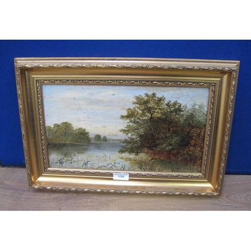 1129 - J.C.S. Tranquil river landscape, indistinctly signed, oil on canvas, 10 x 18in; two coloured strip m... 