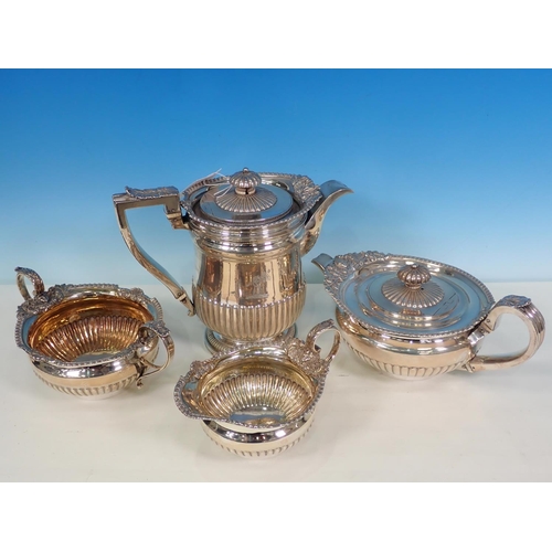 837 - A George III silver four piece Tea Service of circular semi-fluted form having cast mask and scallop... 