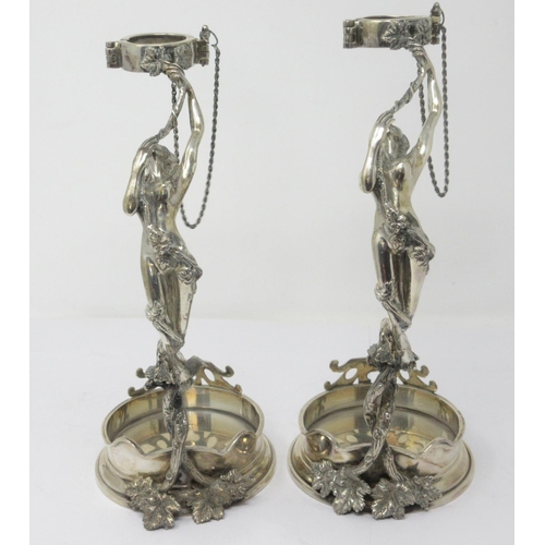 838 - A pair of silver Wine Bottle Holders with female  figure supports on circular bases with vine leaves... 
