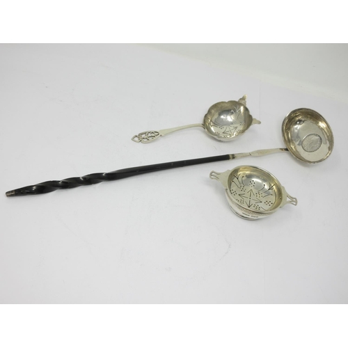 850 - Two silver Tea Strainers, one on stand, and a Toddy Ladle with coin inset bowl and spiral handle