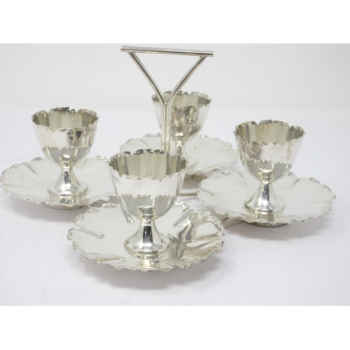 851 - An Edward VII silver four Egg Cup Set on Stand with triangular handle, London 1903, Goldsmiths & Sil... 