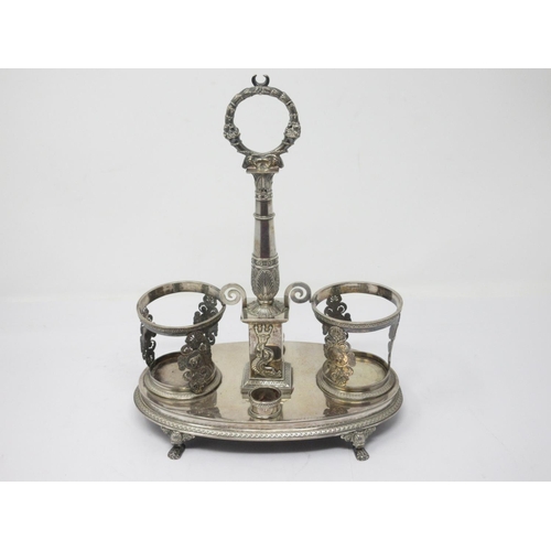 853 - A Continental white metal two division Dish Stand with anthemion, dolphin and trident design on paw ... 