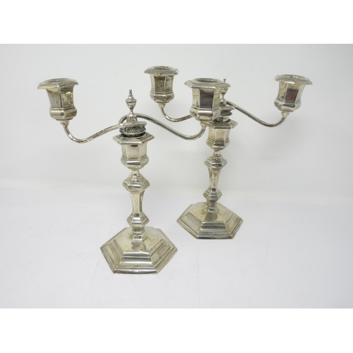 855 - A pair of Victorian silver two branch Candlesticks on hexagonal bases, London 1898, 9 1/2in