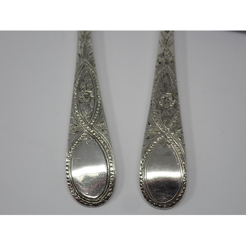 906 - A pair of George III silver Table Spoons with later floral embossed bowls and bright-cut stems, Lond... 