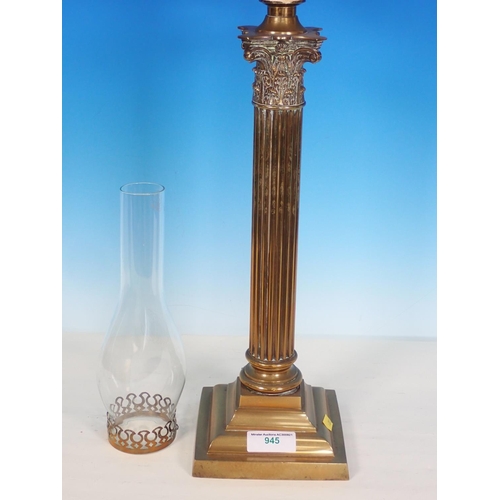 945 - A brass Oil Lamp having brass base with Corinthian capital, cut glass reservoir and shade, 2ft 6in