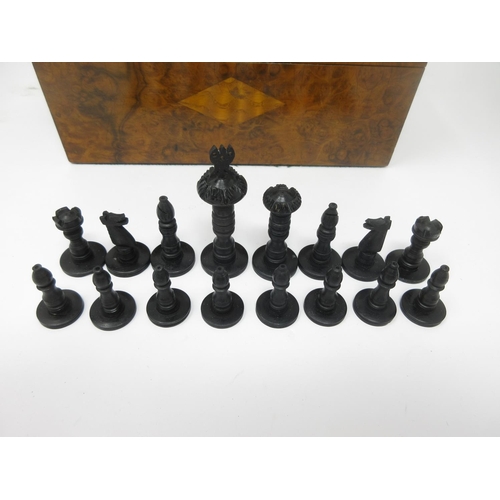 963 - A black and white Chess Set in a shell inlaid mahogany box, 9 x 4 1/2in