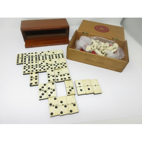 968 - A red and white Chess Set in cigar box, missing red castle and a part set of old bone dominoes in ma... 