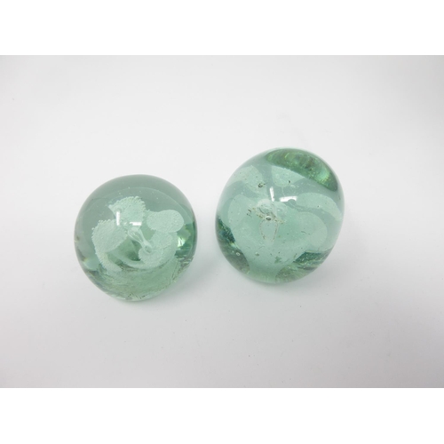 993 - Two Nailsea glass Dumps encapsulating flowers, 2-3in