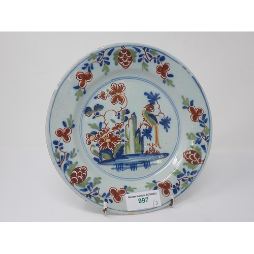 997 - A pair of Lambeth polychrome Delft Plates painted parrot on flowering branch, 9in and a similar Plat... 