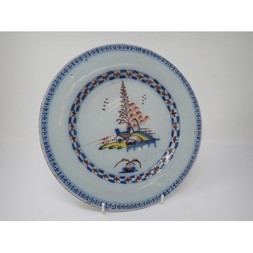 997 - A pair of Lambeth polychrome Delft Plates painted parrot on flowering branch, 9in and a similar Plat... 