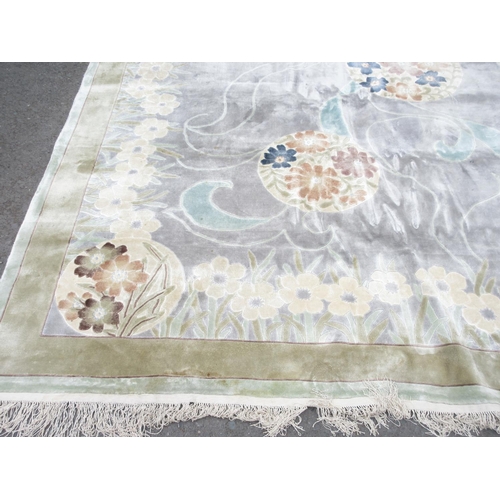 1 - A good quality bordered Chinese Carpet with floral design on pale grey and blue ground, 8ft x 10ft