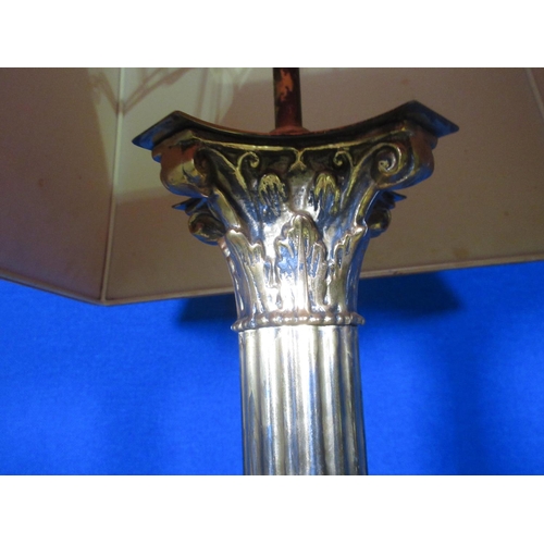 101A - A brass Standard Lamp with reeded column and corinthian capital and paw supports (passed PAT, plug r... 