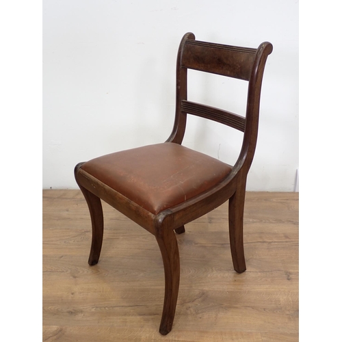 102 - A set of four 19th Century Dining Chairs with sabre front supports and drop in seats