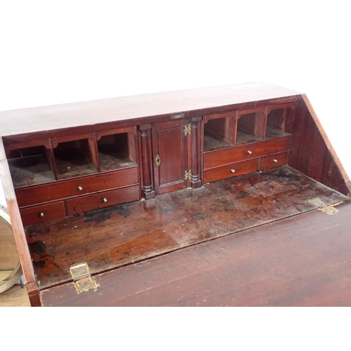 108 - A 19th Century mahogany Bureau with fitted interior above four long graduated drawers on bracket sup... 