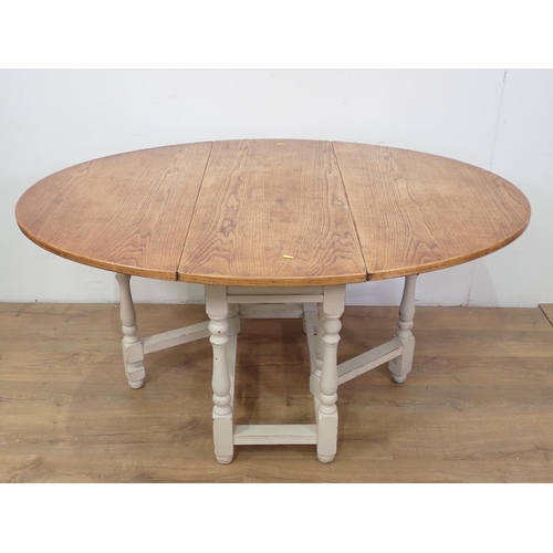 122 - An oak top Gateleg Table with white painted base, 3ft 9in