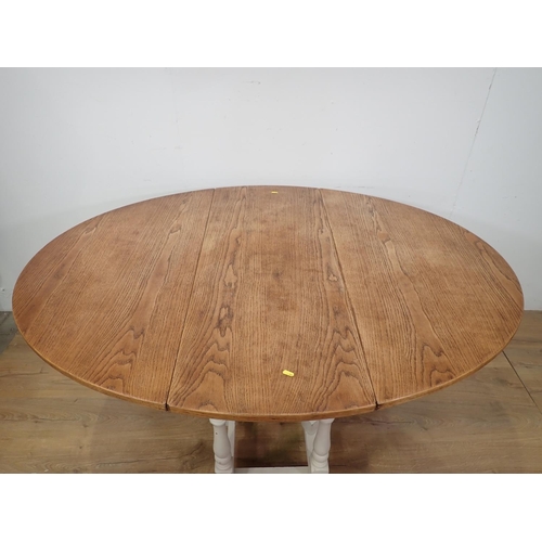 122 - An oak top Gateleg Table with white painted base, 3ft 9in