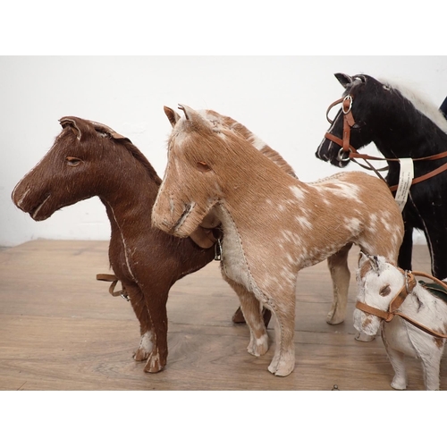 138 - A quantity of stuffed models of horses, horses and carriage, model fences etc