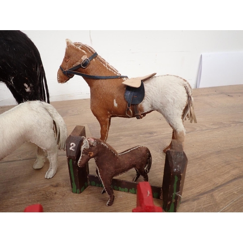 138 - A quantity of stuffed models of horses, horses and carriage, model fences etc