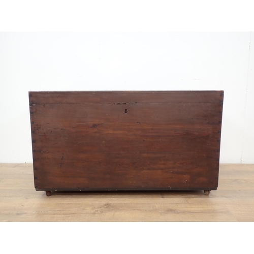 140 - A stained pine Trunk with hinged cover and carrying handles, 3ft 6in W