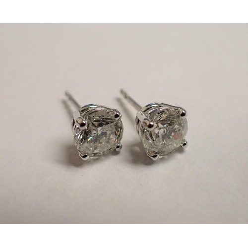 154 - A pair of Diamond Ear Studs each claw-set brilliant-cut stone, total diamond weight 2cts, in 18ct wh... 