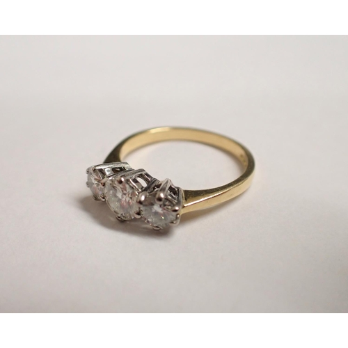 164 - A Moissanite three stone Ring claw-set brilliant-cut stones in 18ct gold, ring size K