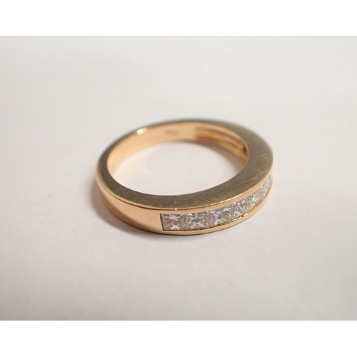 173 - A Diamond half Eternity Ring channel-set princess-cut stones in 18ct rose gold, ring size O