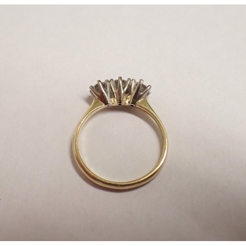 174 - A Diamond three stone Ring claw-set brilliant-cut stones, stamped 18ct, ring size N 1/2