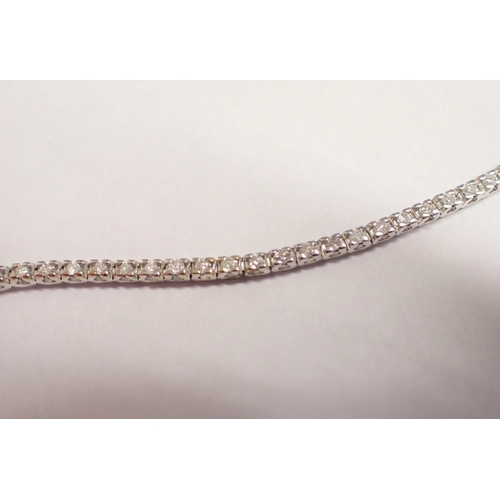 177 - A Diamond Tennis Bracelet each articulated link claw-set brilliant-cut stone, total diamond weight 1... 