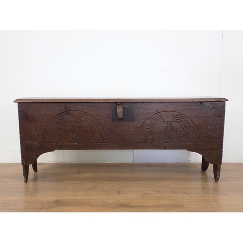 18 - A 17th Century oak Sword Chest with moulded hinged top and carved front, 4ft 2in W