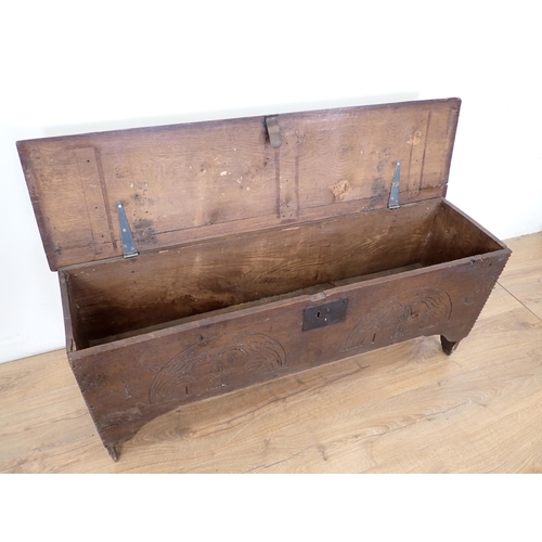 18 - A 17th Century oak Sword Chest with moulded hinged top and carved front, 4ft 2in W