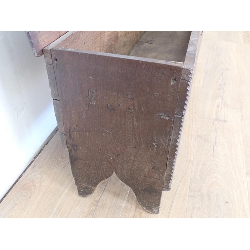 18 - A 17th Century oak Sword Chest with moulded hinged top and carved front, 4ft 2in W