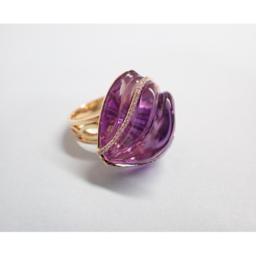 182 - An Amethyst and Diamond Cocktail Ring the carved ripple effect amethyst set two rows of brilliant-cu... 