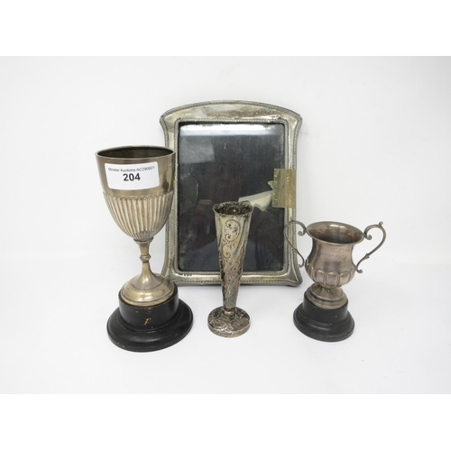 204 - A Victorian silver Spill Vase with scroll design, London 1888, two small silver Trophies and a Photo... 